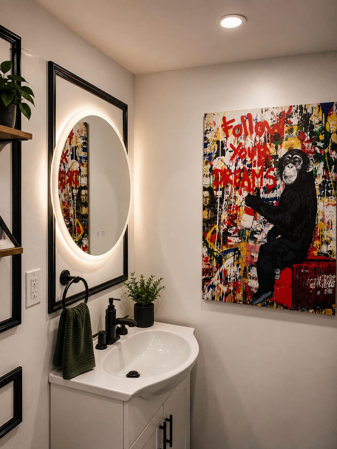 Backlit round mirror above a corner vanity, beside a large street-art canvas reading Follow Your Dreams